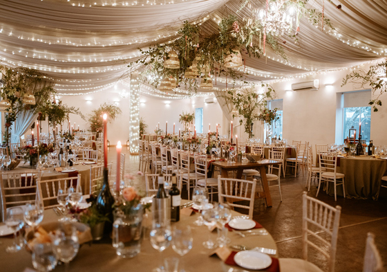 Floral and fairy light decorated marquee set up for dinner Aberdeen Wedding Venue Logie Country House